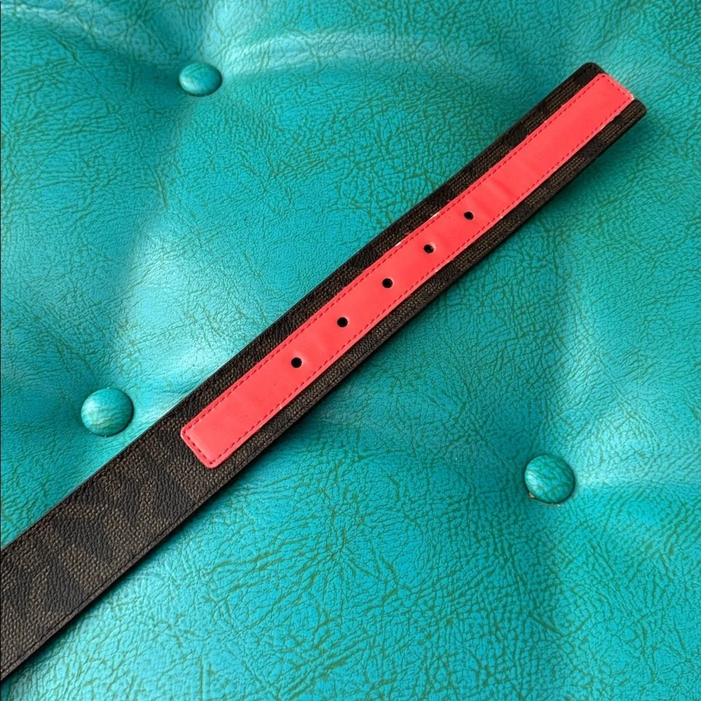 Reversible Michael Kors MK logo belt with bright shiny coral side - see flaw